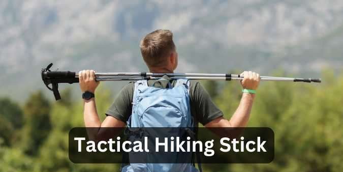 Hiker carrying a Tactical Hiking Stick